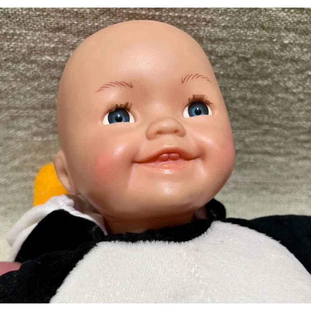Vtg Baby Doll Plush Toy Dressed in Penguin Costume Long Lashes Smile Two Teeth
